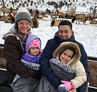 A family viewing elk at Hardware Ranch