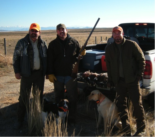 Jason with his dad, brother and dogs.