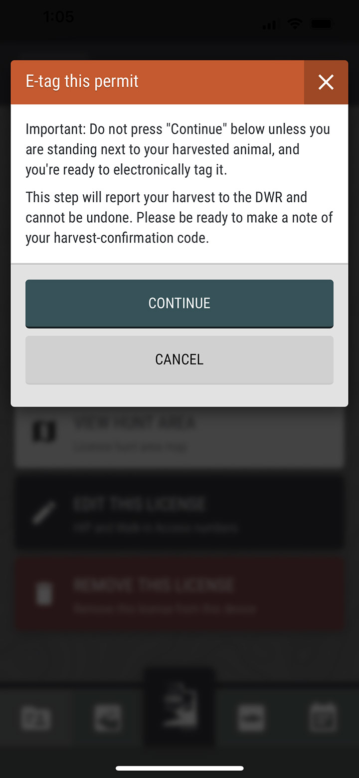 Screenshot of the iOS Utah Hunting & Fishing app showing the "E-tag this permit" confirmation dialog box
