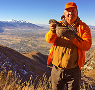 Scott holding a forest grouse