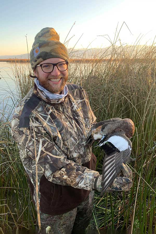 Tom holding a wigeon