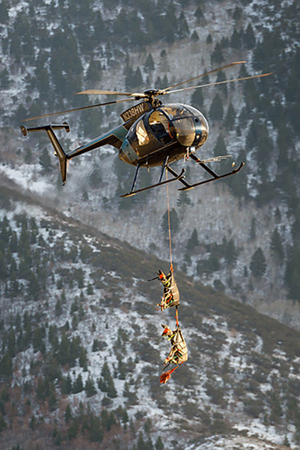 Helicopter hauling deer