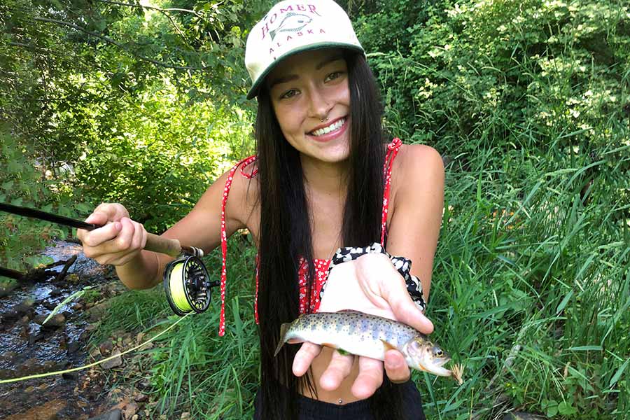 Woman Holding Trout and Fly-Fishing Rod, Photograph