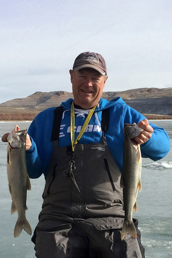 Kent Sorenson holding trout caught through the ice