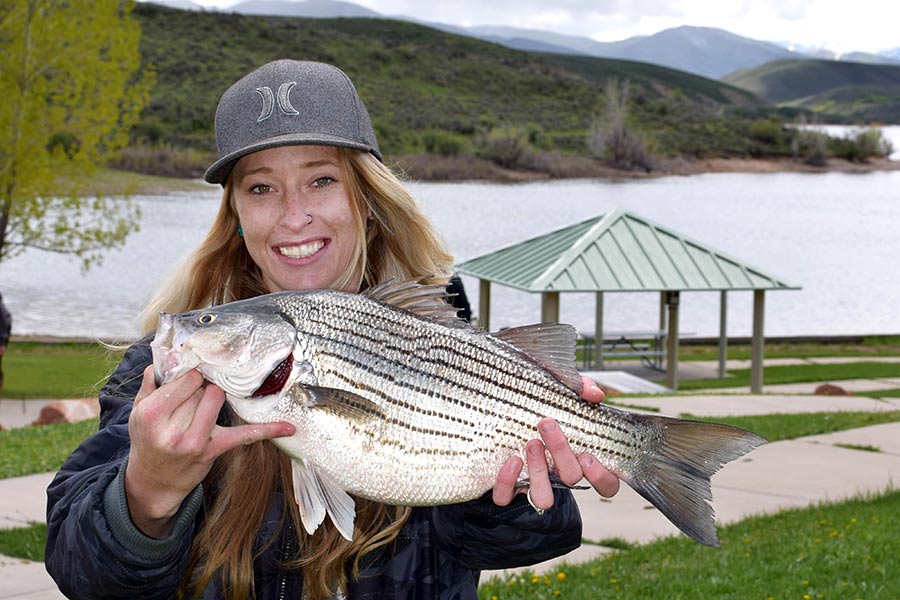 Woman holding a wiper fish caught at East Canyon Reservoir