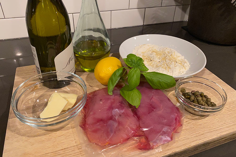 Pheasant piccata ingredients, including pheasant breasts, flour, parmesan cheese, butter, olive oil and lemon juice