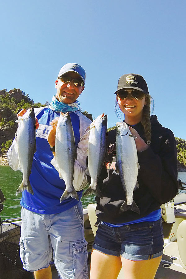 Two anglers holding kokanee salmon caught at Flaming Gorge