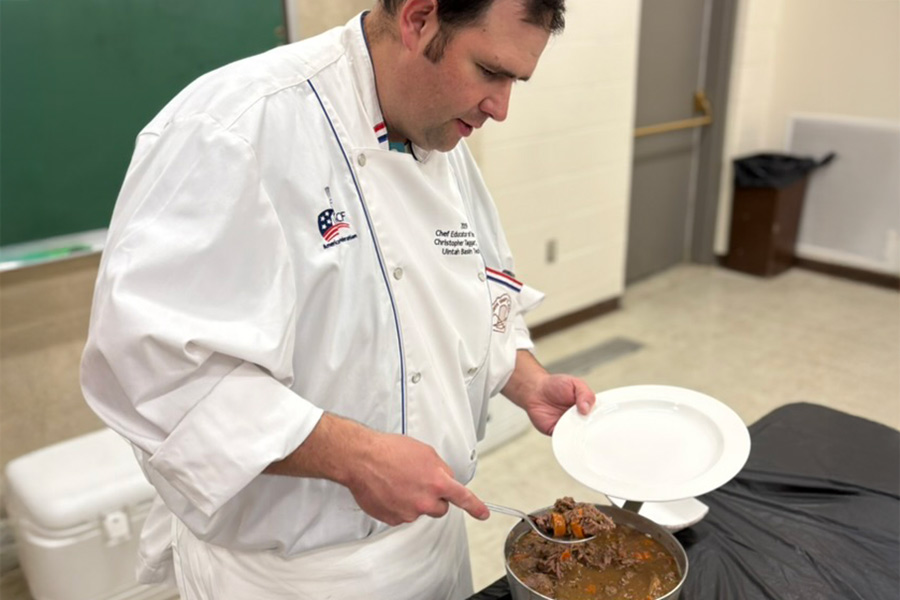 Chef Chris Taggart dishing up a plate of pheasant coq au vin