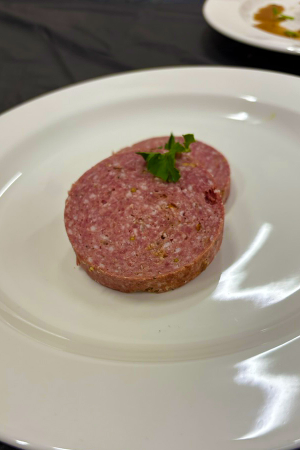 Elk summer sausage, prepared by Chef Chris Taggart, on a plate