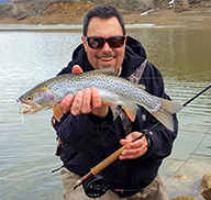 Angler holding a Bonneville cutthroat trout caught at Lost Creek Reservoir