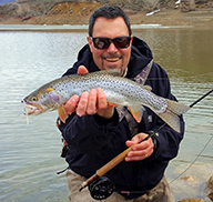 Angler holding a 19-inch Bonneville cutthroat trout caught at Lost Creek Reeservoir