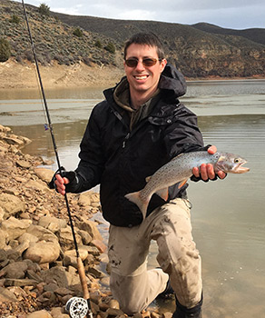Chris Penne holding a Bonneville cutthroat trout caught at Lost Creek