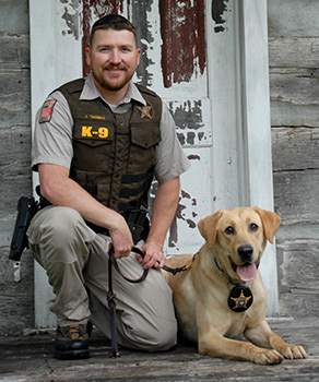 DWR Officer James Thomas and police dog K-9 Kip