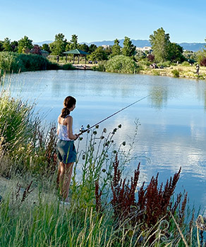 Girl fishing at Riverfront Pond