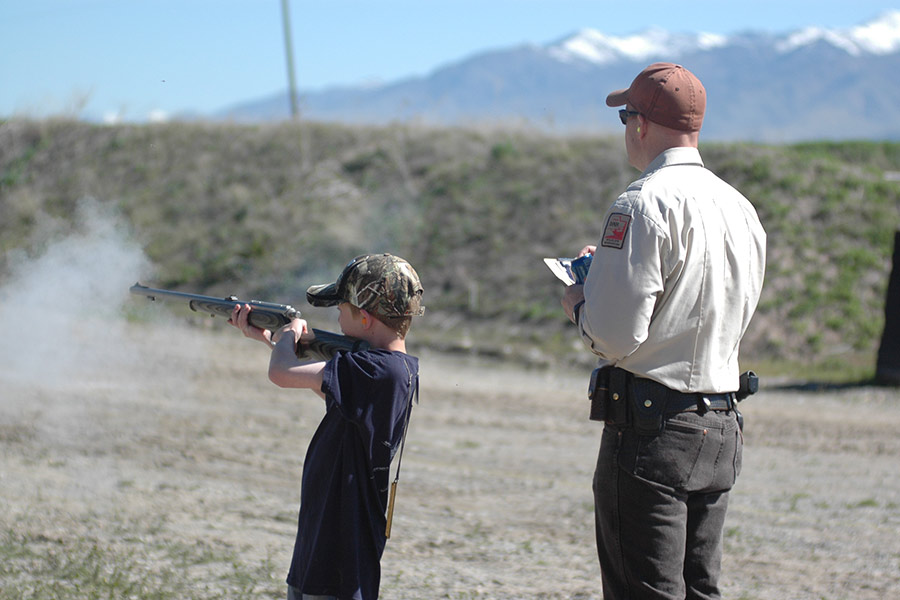 Father and son at a shooting range