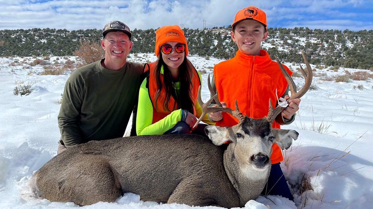 Aubrey Tuttle with her husband and son on a deer hunt