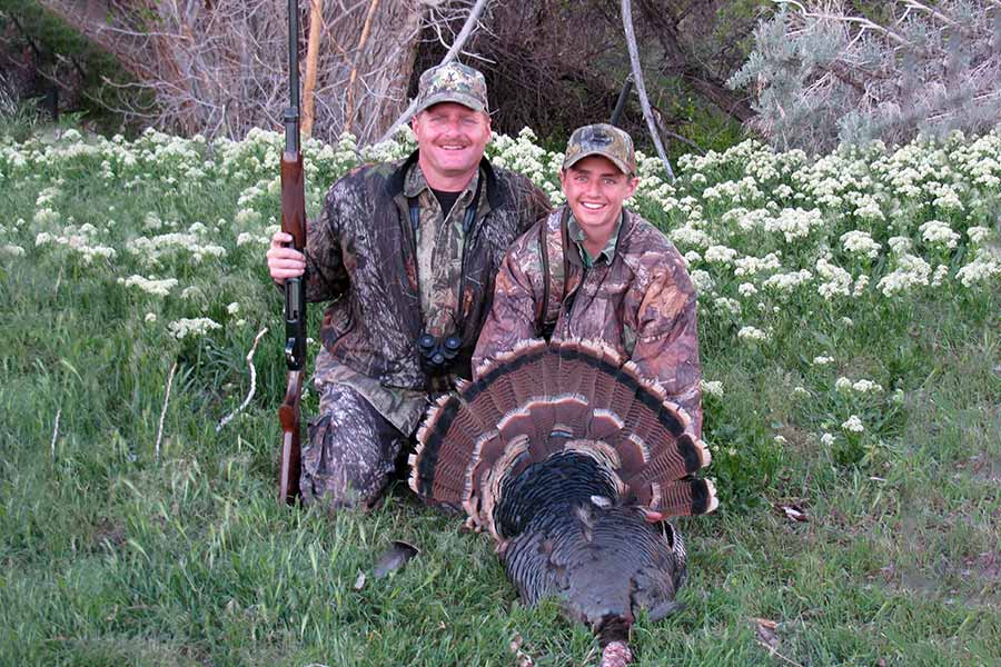 Father and son with turkey
