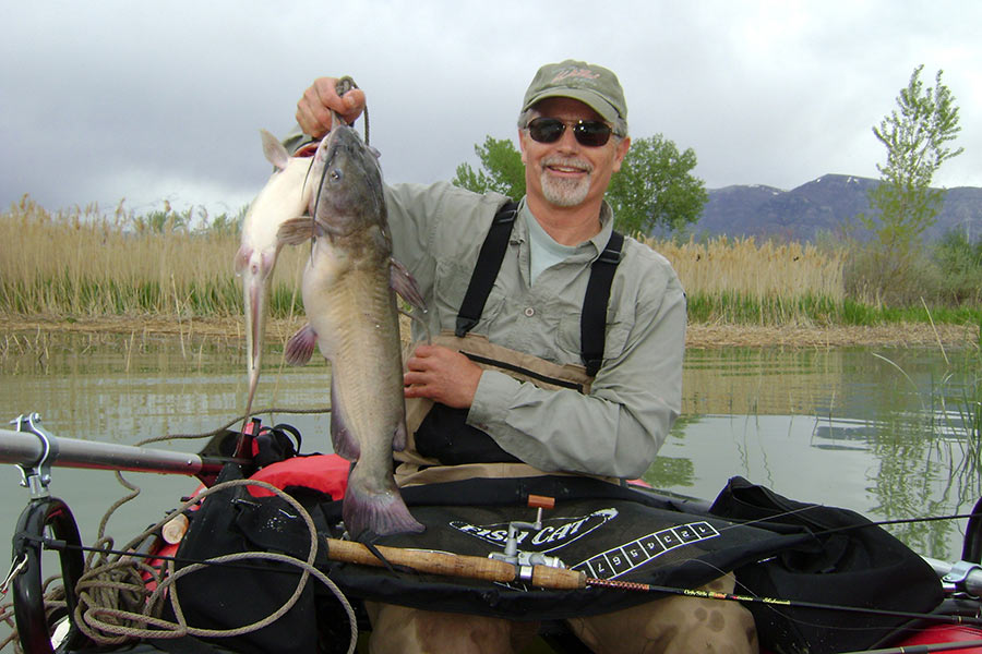 Angler holding a channel catfish
