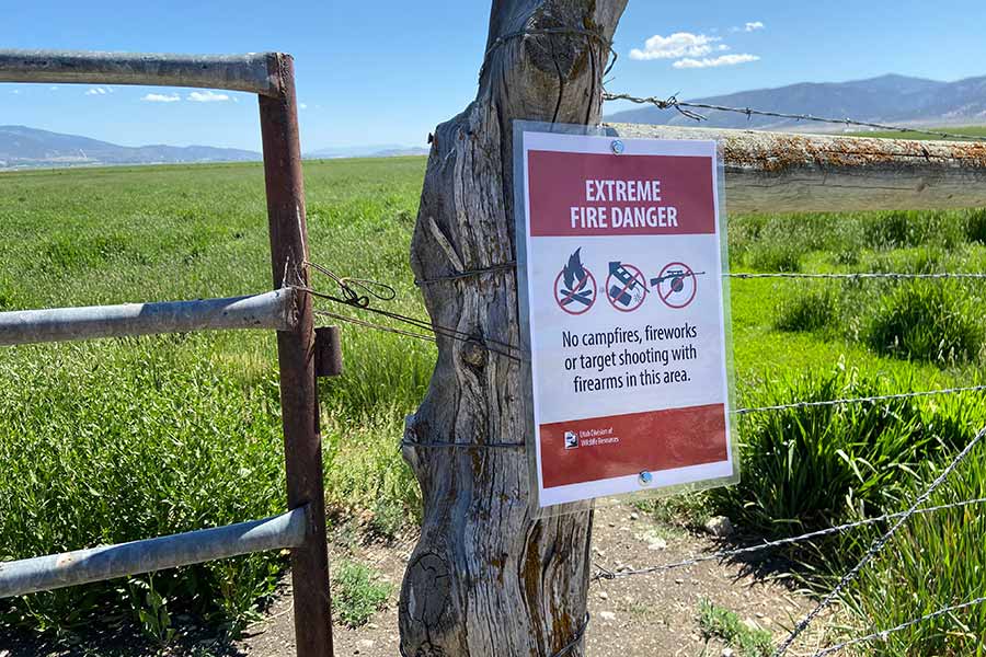 Wildlife Management Area sign, saying "Extreme fire danger: No campfires, fireworks or target shooting with firearms in this area"