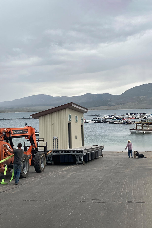 Workmen installing a new boat slip at Flaming Gorge Lucerne Marina