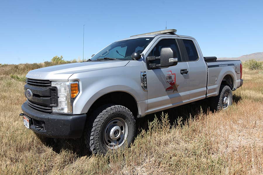 Utah Division of Wildlife Resources Law Enforcement truck, parked above brush